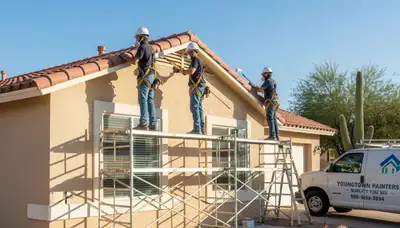 Painting contractor in Glendale, AZ applying exterior paint on a home facade